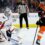 NHL-leading Caps top Flyers 2-1 in SO to extend point streak
