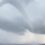Huge waterspout seen spiralling from sea to sky in Cornwall as heavy rain hit UK